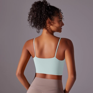Detail of the thin straps and back design on this high-stretch mint green sports bra