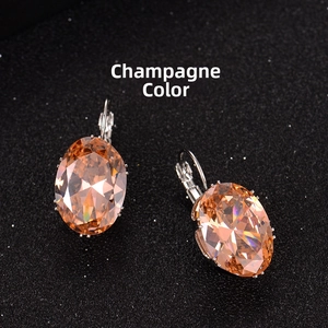 Detail of champagne oval-cut crystal earrings with elegant lever-back closure