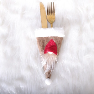 Plush Christmas gnome cutlery holder with red hat and white beard for festive table decor
