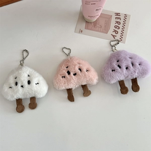 Close-up of colorful plush mushroom keychains with soft texture and metal chains