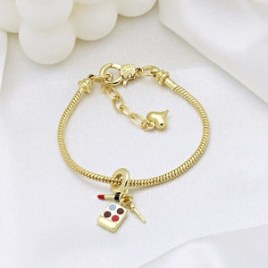 Elegant gold S925 silver bracelet featuring lipstick and eyeshadow palette charms