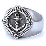 Macro shot of vintage silver nautical ring featuring detailed anchor relief and compass design