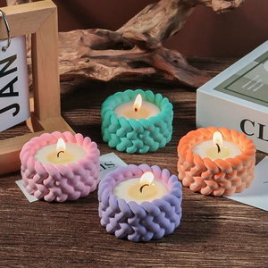 Set of four woven texture candle holders in pink, blue, purple and orange colors