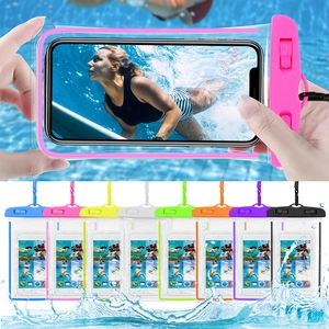 Pink waterproof phone pouch for swimming and drifting shown in clear underwater scenery