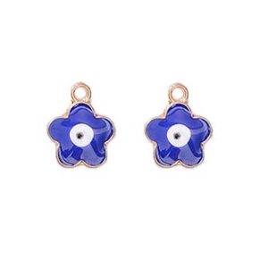 Detail of blue flower enamel evil eye charms with gold metal edges and hanging loops