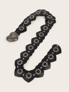 Detail of heart-shaped PU leather links with silver buckles and metal rivet accents