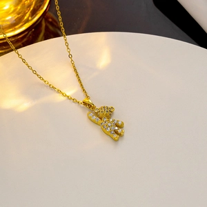 Elegant gold bear pendant necklace with sparkling cubic zirconia on a minimalist chain