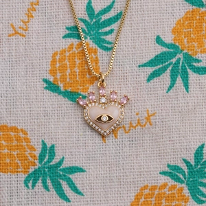 Gold plated crown heart necklace with evil eye and pink gemstones on box chain