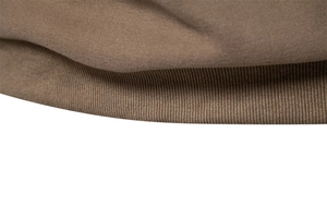 Macro detail of brown cotton sweatshirt showing ribbed hem and knit fabric texture
