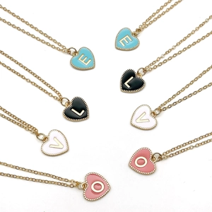 Double-sided heart alphabet pendant necklaces in blue, black, white, and pink enamel