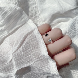 Macro detail of 925 sterling silver open ring with dual-color triangle geometric design