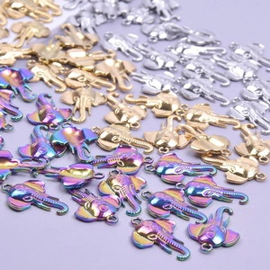 Polished stainless steel elephant charms in gold, silver, and rainbow colors for jewelry