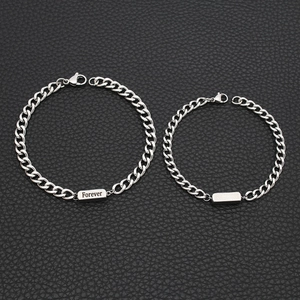 Detail showing polished silver Cuban chain bracelets with Forever and Always engraving