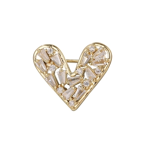 Elegant gold heart brooch with sparkling rectangular and round crystals on white background