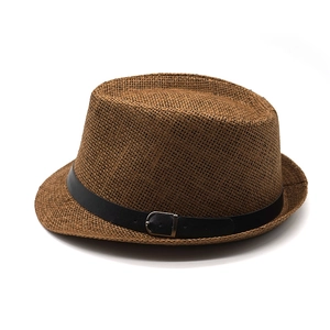 Detail of brown straw fedora featuring a black leather band and silver metal buckle