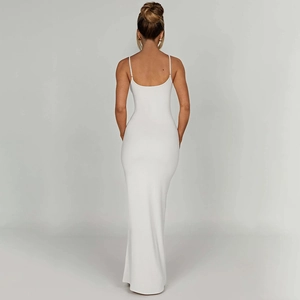 Detail showing the elegant backless design and slim fit of the white maxi dress