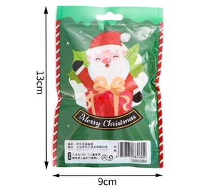 Green Christmas blind bag featuring cartoon Santa Claus with 13cm by 9cm size dimensions