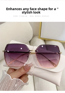 Detail of gradient purple lenses on titanium geometric sunglasses with white leather pouch