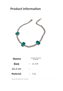 Detail of silver alloy bracelet featuring green oval crystals and sparkling rhinestones