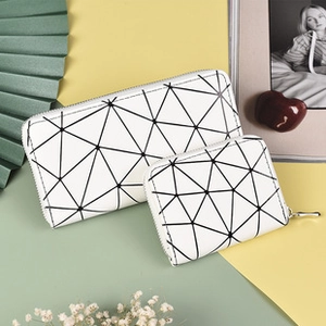 Detail of white PU leather wallet set with geometric triangle patterns and zipper closure