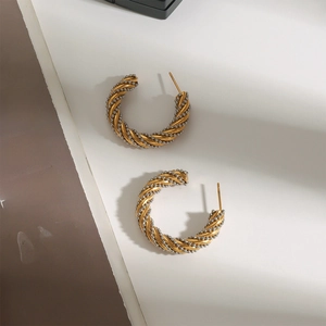 Boucles d'oreilles créoles torsadées bicolores en acier inoxydable plaqué or 18k