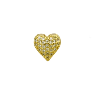 Detailed close-up of a golden heart stud earring paved with shiny zircon stones