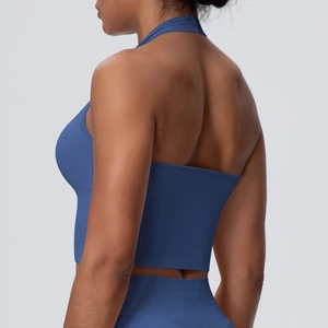 Detail of the halter back design on a dark blue seamless yoga sports bra for women
