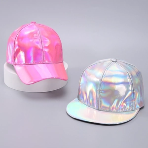 Close-up of pink and silver holographic PU baseball caps showing metallic laser reflections