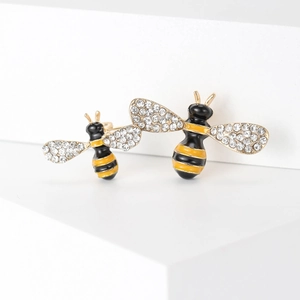 Chic gold bee brooch pair with yellow enamel stripes and sparkling crystal wings on steps