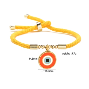 Detail of yellow braided evil eye bracelet showing 14.5mm pendant size and 5.7g weight