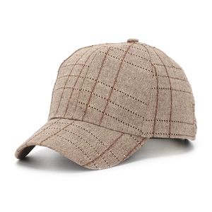 Close-up of retro plaid baseball cap featuring brown checkered pattern and curved brim