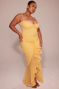 Detailed view of yellow ruched maxi dress featuring elegant ruffle trim and mesh fabric texture