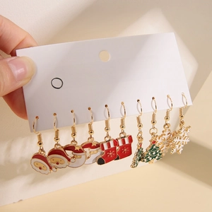 Close-up of colorful Christmas themed enamel stud earrings set featuring festive designs