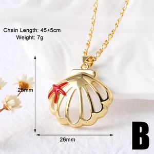 Macro shot of gold shell pendant with red starfish detailing and size specifications