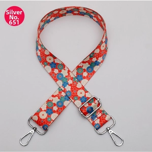 Adjustable floral pattern bag strap with red floral fabric and silver lobster clasps
