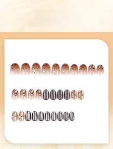 Detailed press-on nails with leopard print, amber texture, and rhinestones