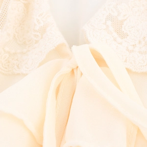 French style V-neck dress with lace ruffled collar and tie-up bow detail in beige