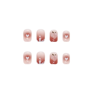 Cute pink gradient press-on nails with 3D peach charms and white heart designs