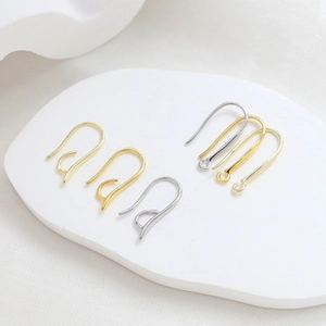 Close-up of gold and silver plated metal earring hooks for DIY jewelry making