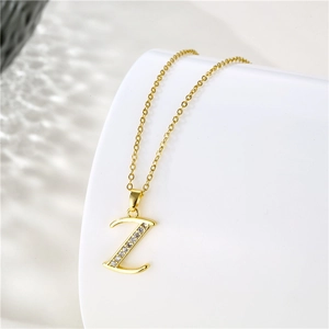 Macro shot of gold-plated letter Z pendant with sparkling cubic zirconia on O-chain