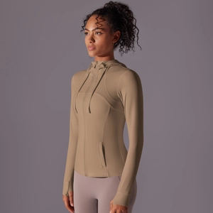 Close-up of slim fit athletic jacket with thumbholes and curved seams for contouring