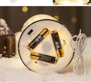 Detail view of the Christmas ornament base featuring USB and AAA battery dual power supply