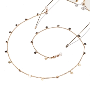 Detail of gold star-patterned eyewear chain with anti-slip silicone loops on white background