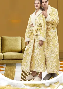 Close-up of thick yellow flannel robe with floral relief pattern and white plush trim