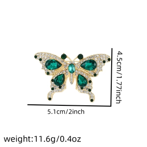 Detail of emerald green butterfly brooch with 5.1x4.5cm size and 11.6g weight info
