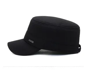 Detail view of the black wool military cap with a classic metal logo and ear protection