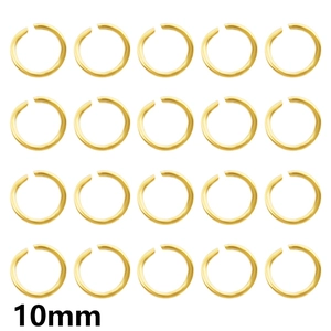 Macro detail of twenty pieces of 10mm golden open jump rings for DIY jewelry making
