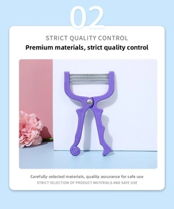 Detailed macro view of purple spring facial hair remover tool with ergonomic handle