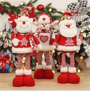 Detailed view of knitted Christmas plush dolls including reindeer, snowman, and Santa Claus