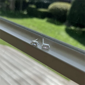Macro shot of S925 sterling silver rectangular square stud earrings with clear gemstone